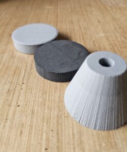 Pommel Kits (3/8" ID) 6lb gumdrop, 4lb disc, and 2lb disc lined up like a train on a wooden table
