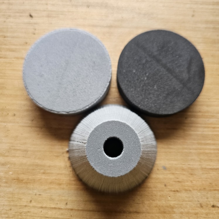 Pommel Kits (3/8" ID) 6lb gumdrop, 4lb disc, and 2lb disc placed individually on a wooden table