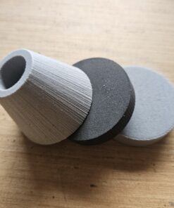 Pommel Kits (7/8" ID) Three pieces of round foam leaning on each other on a wooden table