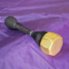 Stab Only Dagger with Golden Cover on a purple background